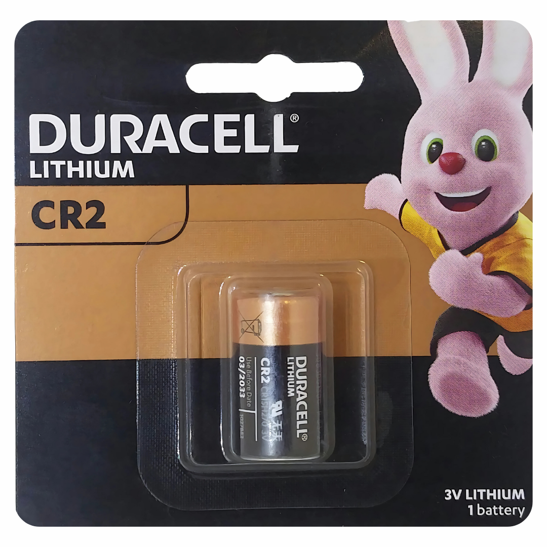 Duracell CR2 lithium battery in packaging with a cartoon character on a black background